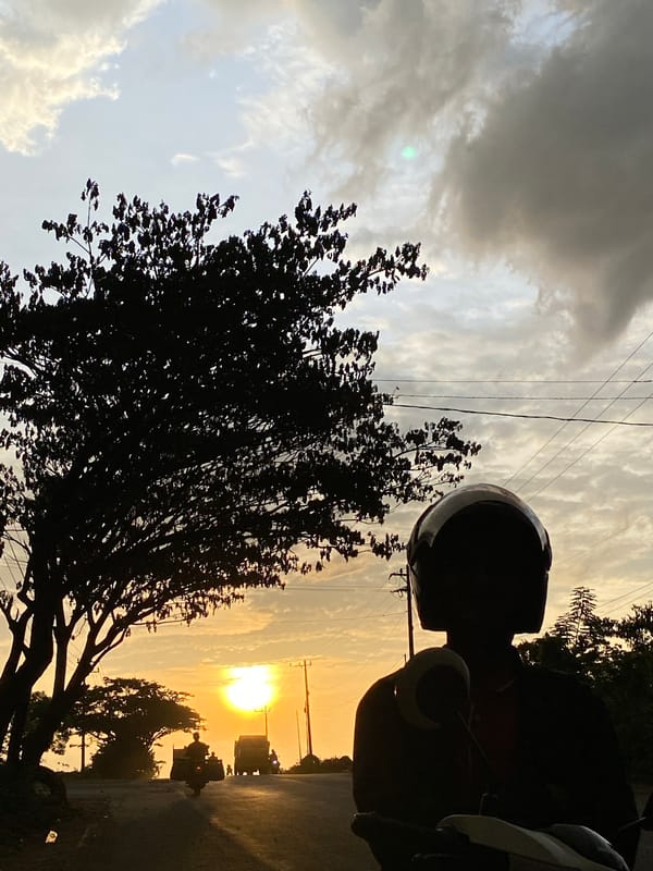Sunset traffic on a Lhokseumawe road, golden hour silhouettes