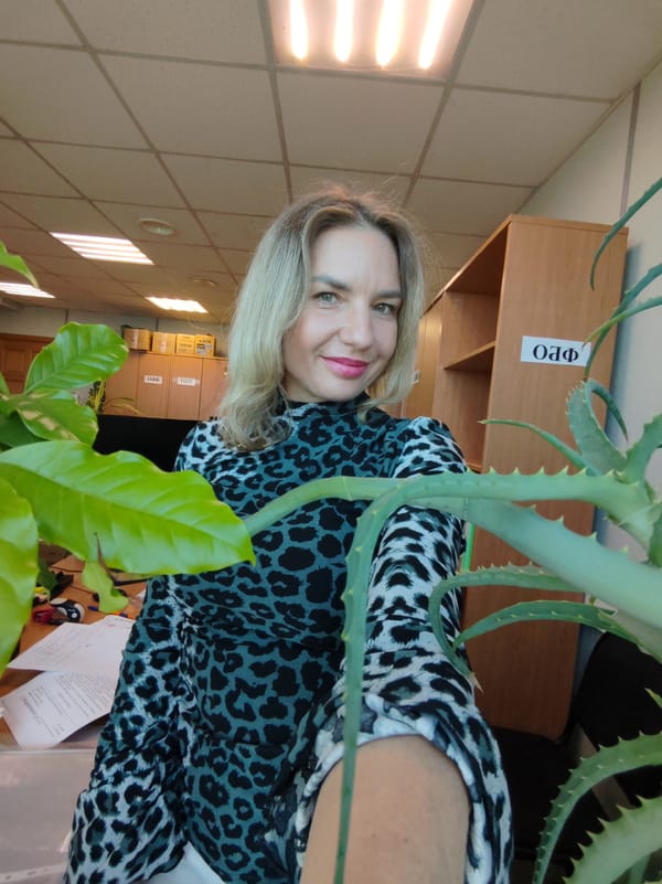 Woman takes multiple office selfies in leopard print top