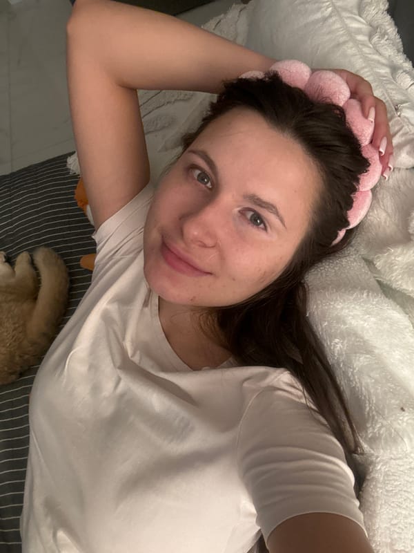 Evening snapshots capture woman and cat in Odintsovo bedroom