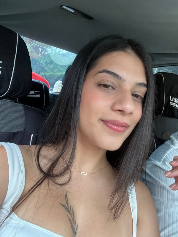 Woman in white top observed in car front seat