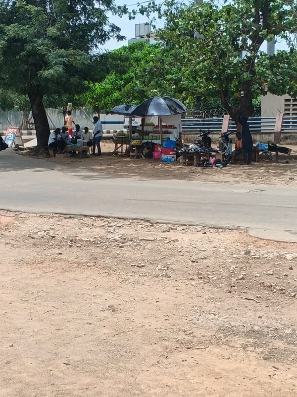 Residents gather at fruit stand in Shaba, Nigeria
