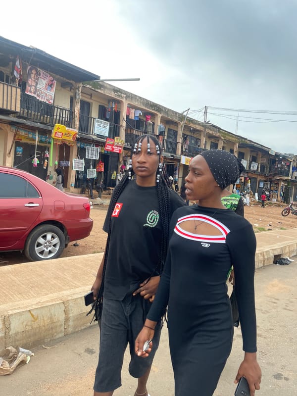 Midday street life in a busy Jos commercial district