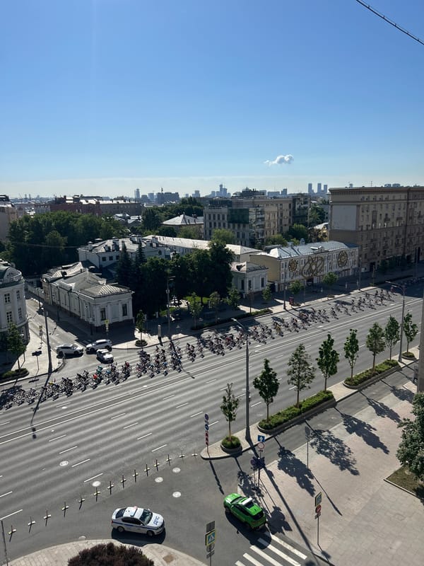 Cycling group travels Moscow street in morning formation