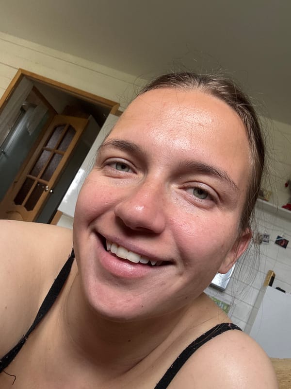 Woman takes morning selfies in Russian kitchen