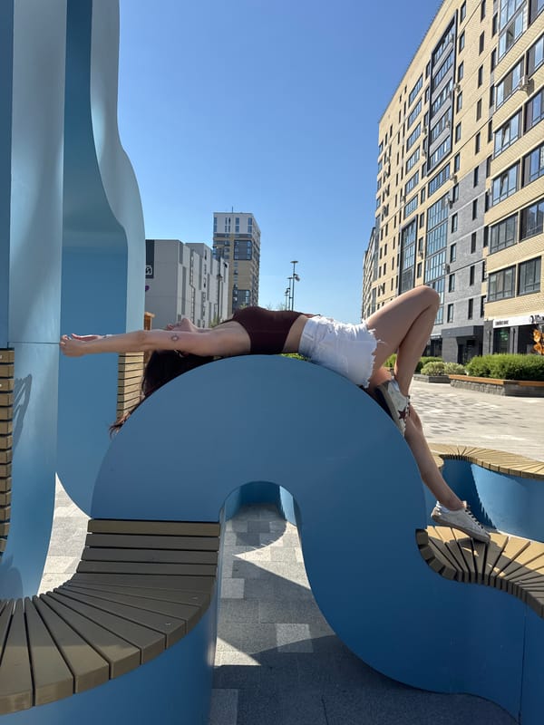 Woman performs morning acrobatics on public benches in Tyumen