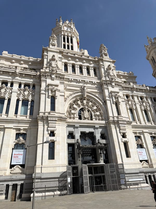 Madrid's Gran Vía and Cibeles landmarks on a clear afternoon