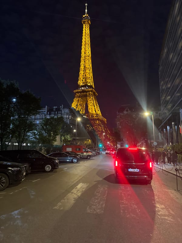 Eiffel Tower captured illuminated against evening sky in Paris