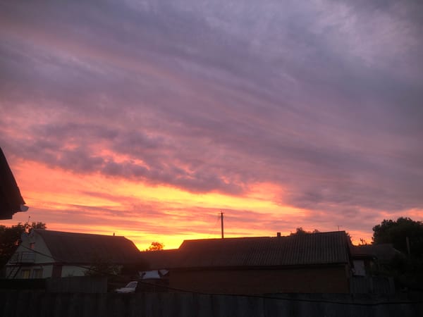 Sunset sky shifting through orange, pink, and purple