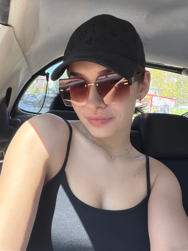 Woman poses for photos in car in Sofia