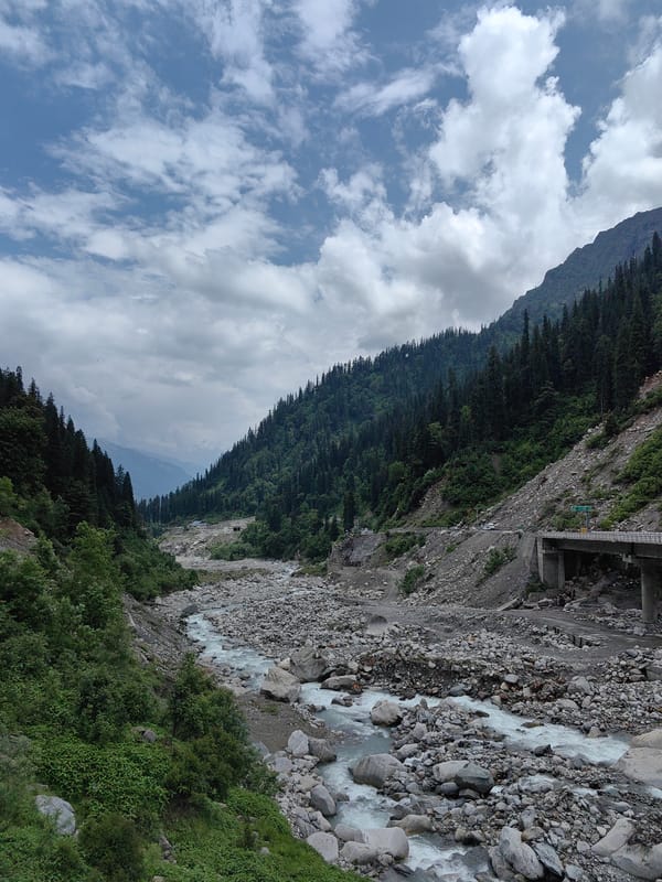 Rocky river valley and mountain road near Dhundi, Himachal Pradesh