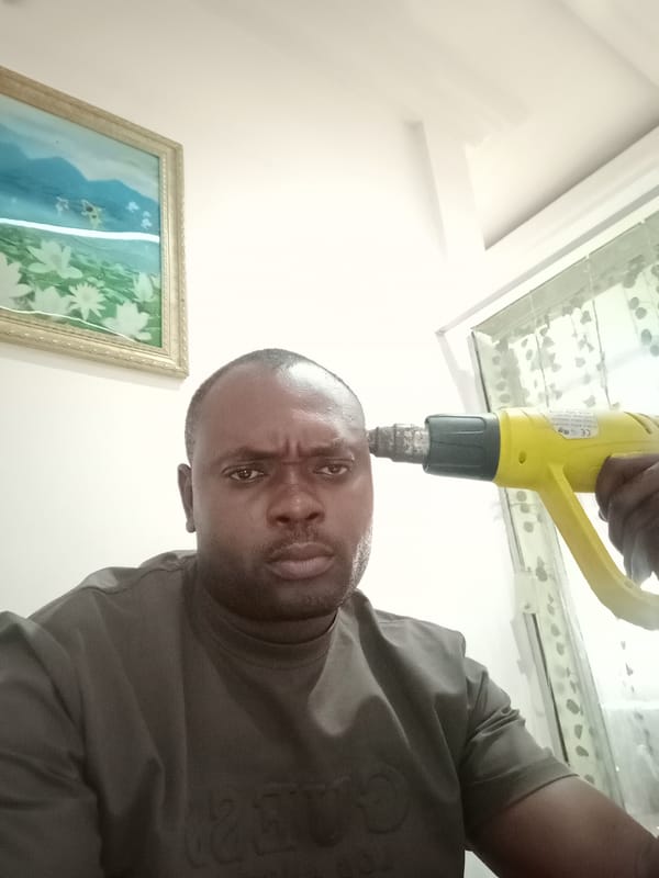 Man photographed with heat gun in Gwarinpa, Nigeria