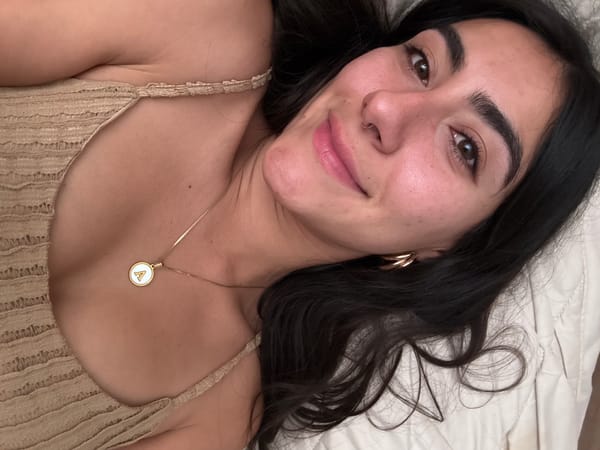 Woman photographed on bed in Puebla, Mexico