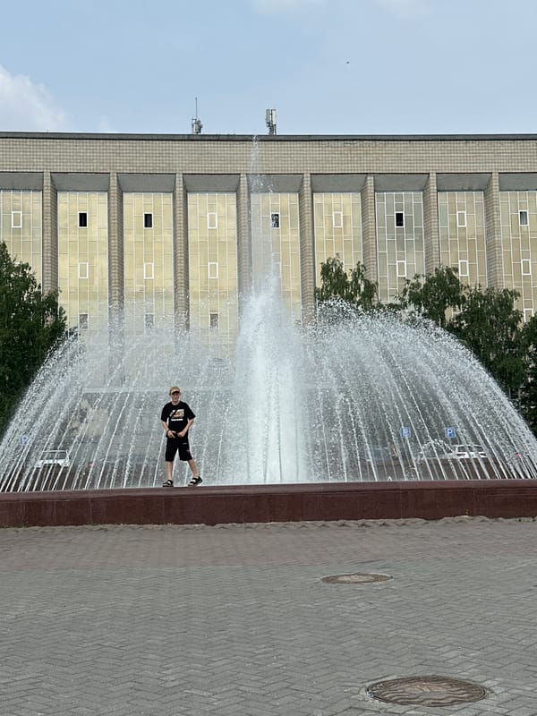 Novosibirsk plaza fountain and public art on a summer morning