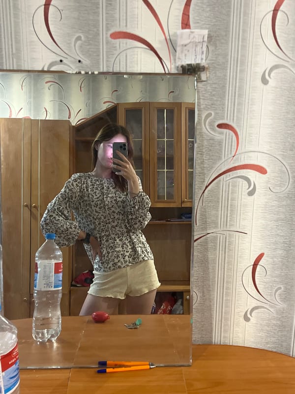 Woman takes morning selfies in bedroom and bathroom