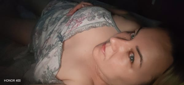 Woman photographed resting at home with pet dog in Russia