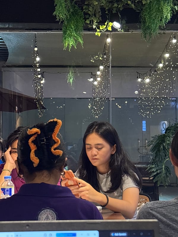 Cafe hangout in Davao City with food, laptops, and selfies