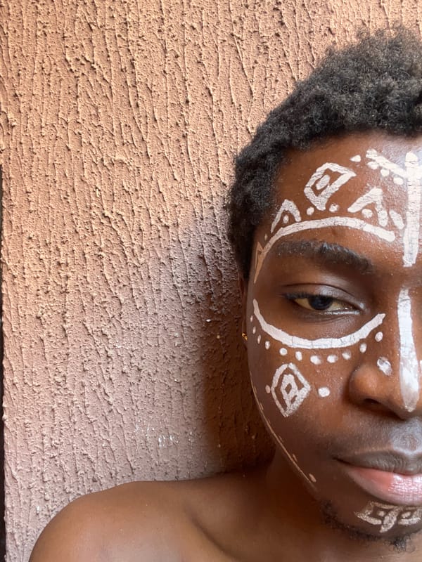Person with traditional face paint photographed in Nkpor, Nigeria