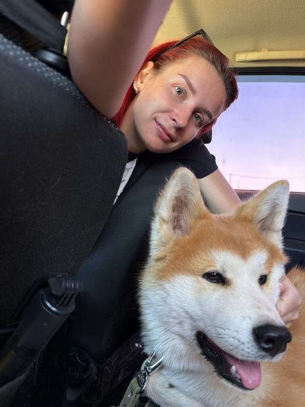 Woman takes selfie with Akita dog in Chaikovsky