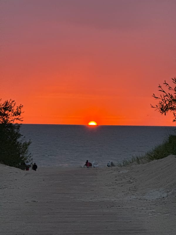Summer evening camping and scootering along the Baltic coast