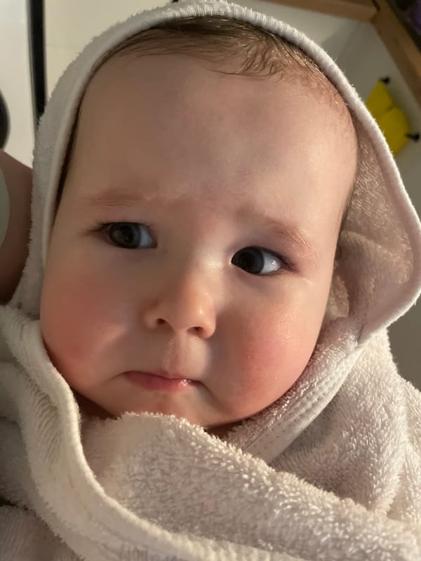 Baby photographed after bath in Chaikovsky, Russia