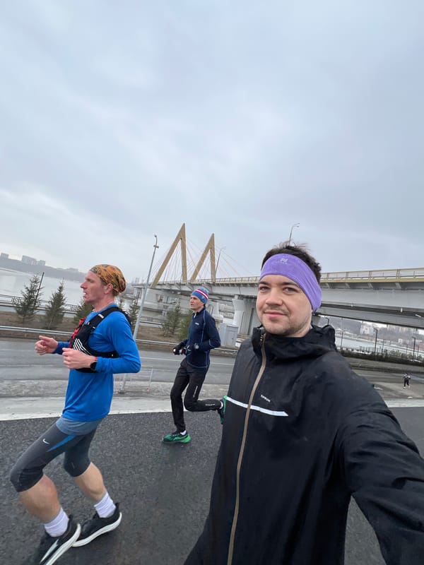 Morning runners take group selfie on snowy Kazan walkway