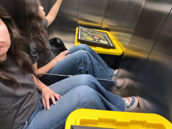 Person rides elevator in mirrored walls, Mexico