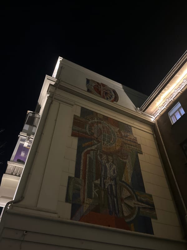 Soviet-era building with mosaic mural documented in Krasnoyarsk