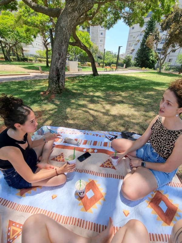 Sunny picnic in a Ramat Gan park with drinks