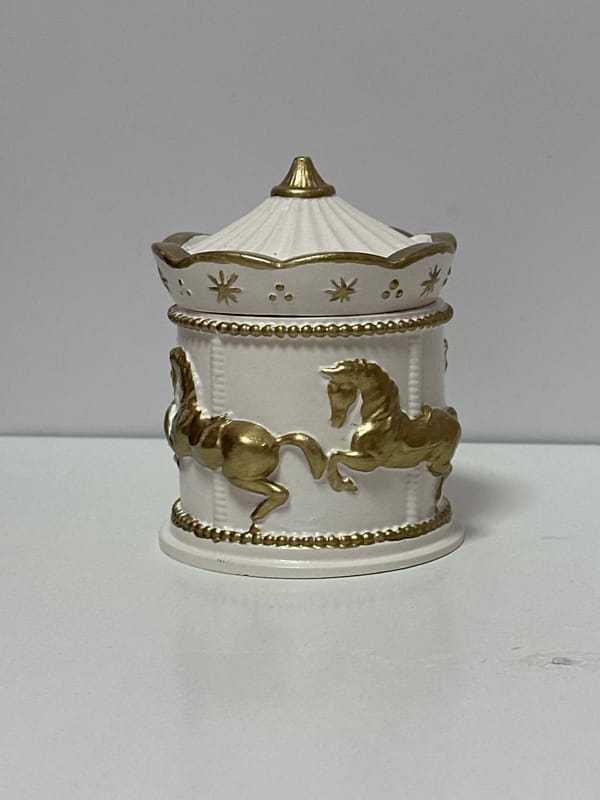 Ceramic decor, cat figurines, and a Pomeranian at home