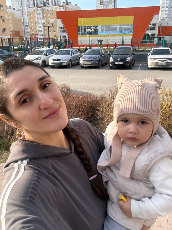 Woman photographed with baby in sunny Tobolsk