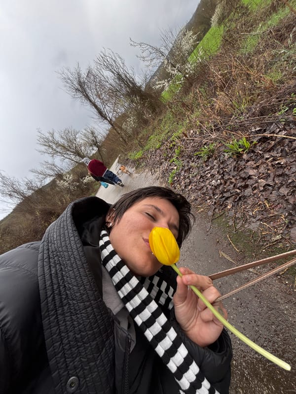 Woman holds yellow tulips during spring walk in Bulgaria