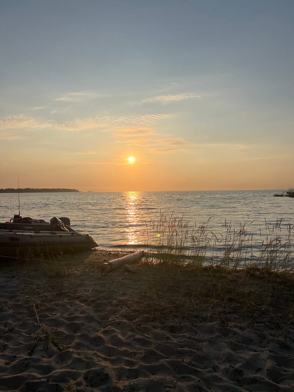 Golden hour at Lake Borovoe, boats ashore at sunset
