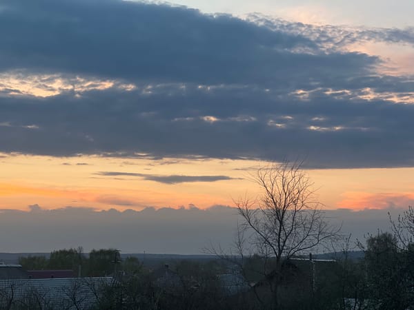 Dramatic sunset captured over Votkinsk, Russia with layered clouds