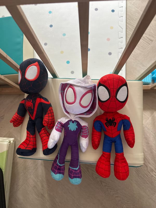Three Spider-Man plush toys lined up in Leeds