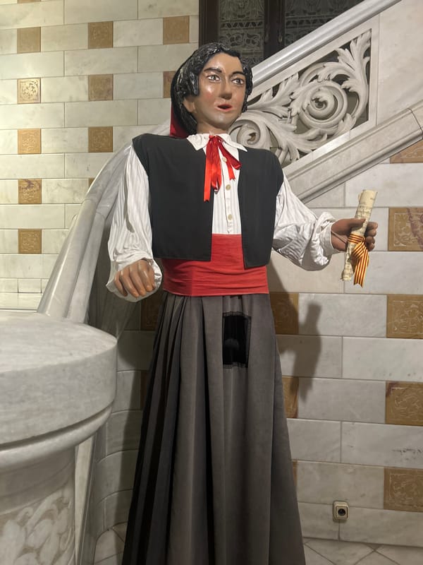 Traditional Catalan statue spotted on Barcelona staircase