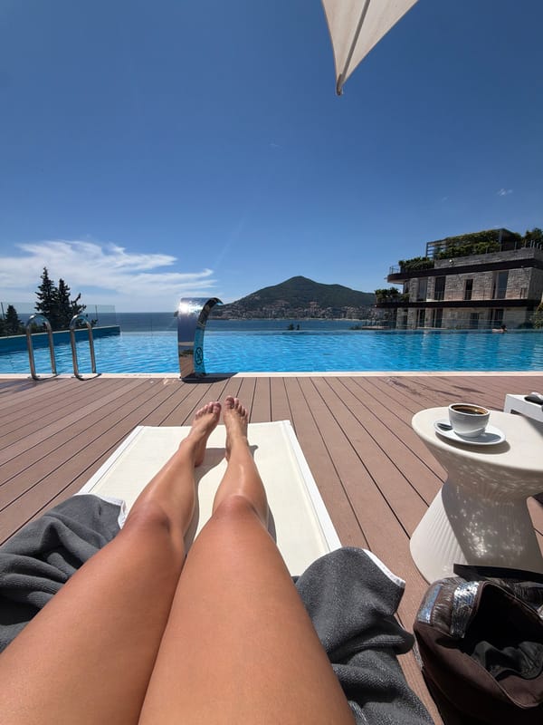 Poolside relaxation at Budva infinity pool overlooking Adriatic Sea