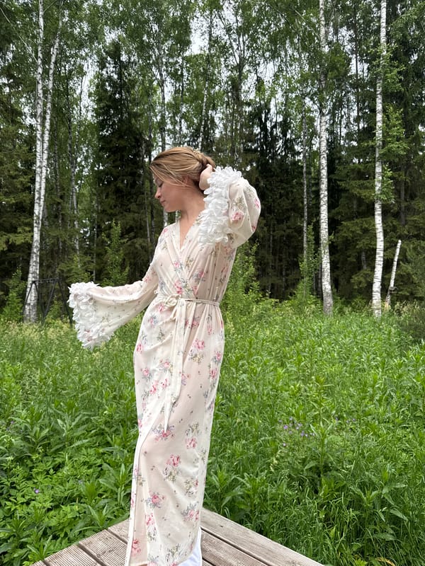 Woman photographs morning robe session in rural Russia