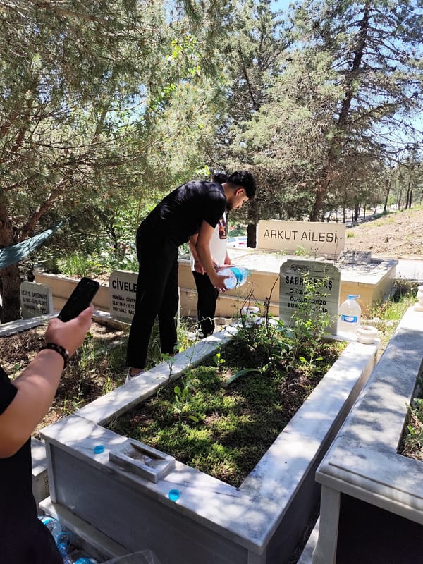 Cemetery visitors tend graves in Sarıyer, Turkey morning