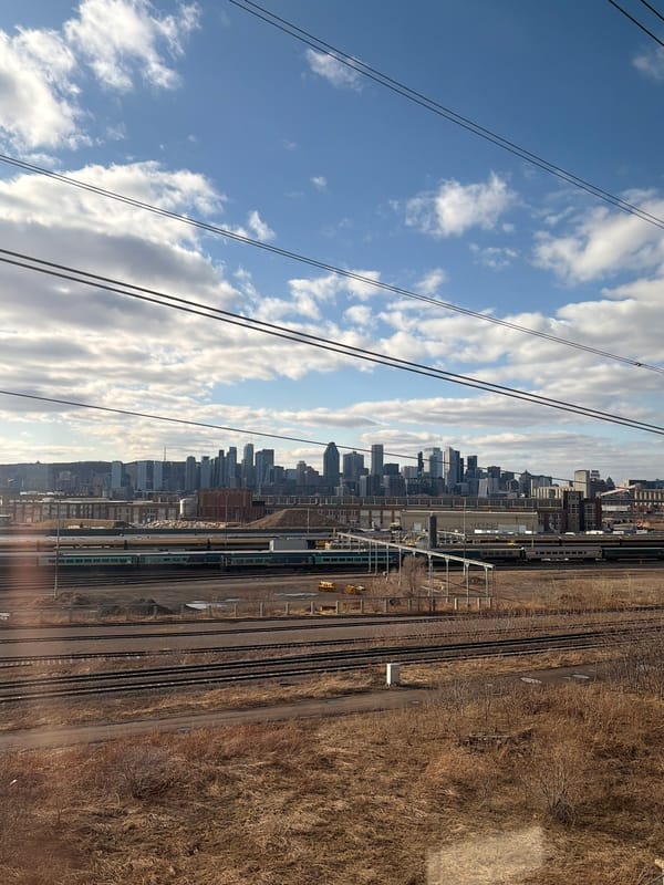 Montreal cityscape photographed from railway tracks area