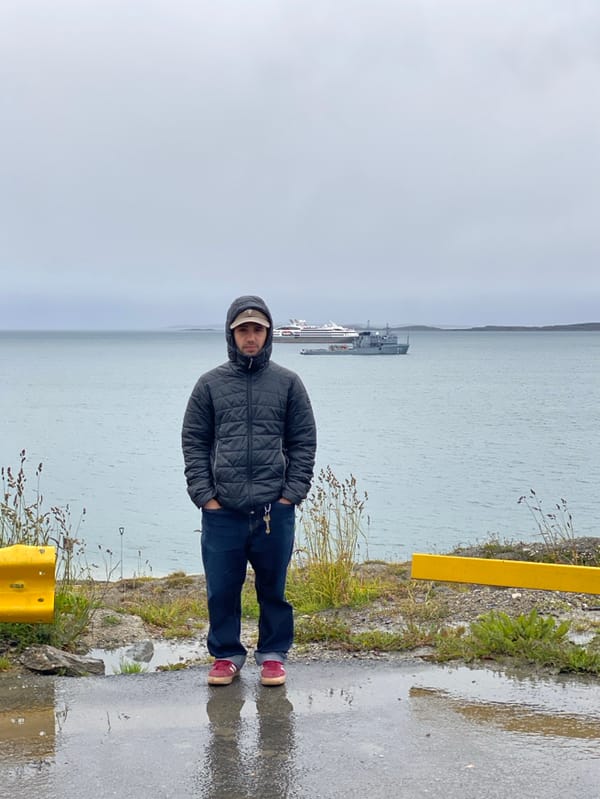 Person observed standing by calm waters in Ushuaia