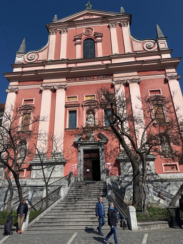 Tourist documents sunny morning tour of central Ljubljana landmarks