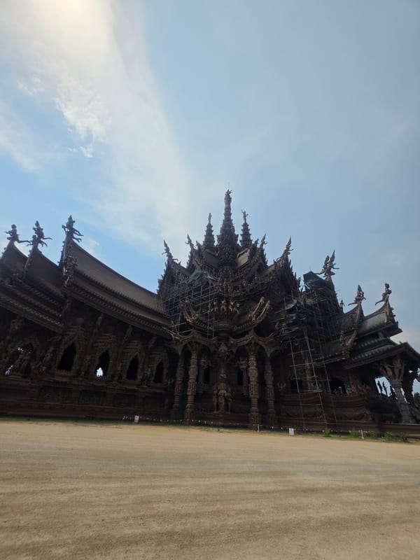 Tourist documents Pattaya's Sanctuary of Truth temple and artisan workshops