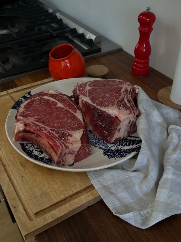 Seasoned ribeye steaks prepared for cooking in French coastal town