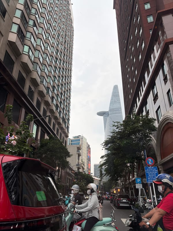 Morning commute captured on Thủ Đức streets under overcast skies