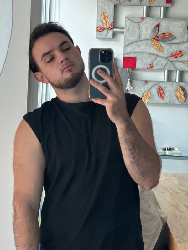 Man Takes Mirror Selfie in Mexican Bedroom