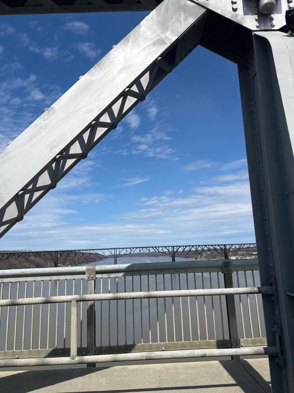 Visitor documents walkway structure on Hudson River bridge