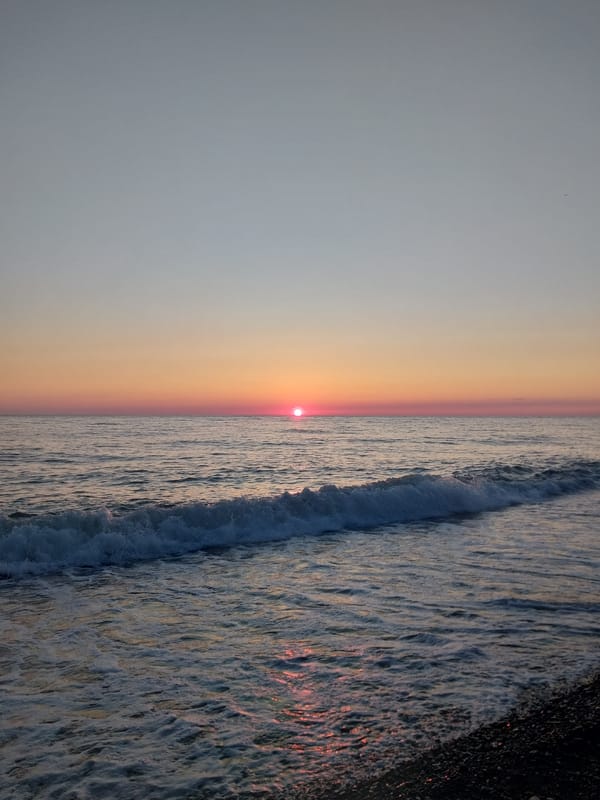 Coastal sunrise captured in multiple photos along Sochi waterfront