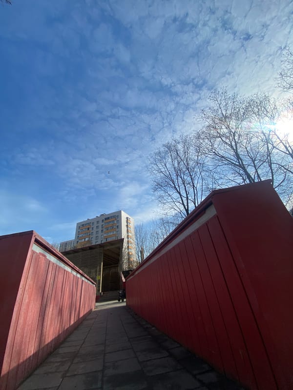 Spring morning sky observed between red buildings in Khimki