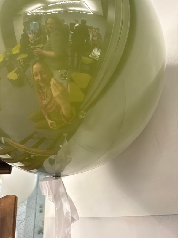 Green balloon with white ribbon spotted in Riga