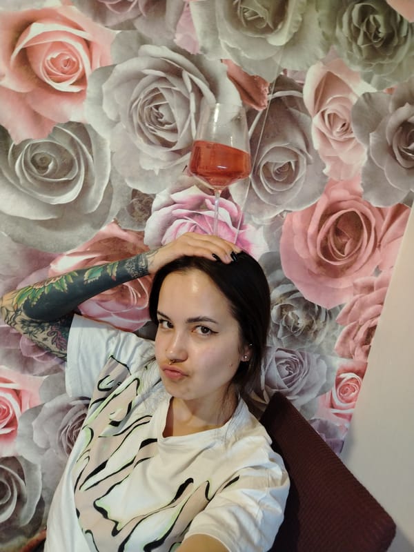 Woman documents wine gathering with food in Noviy, Russia